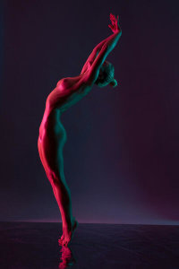 Andrey Guryanov - Young naked woman dance against dark purple background